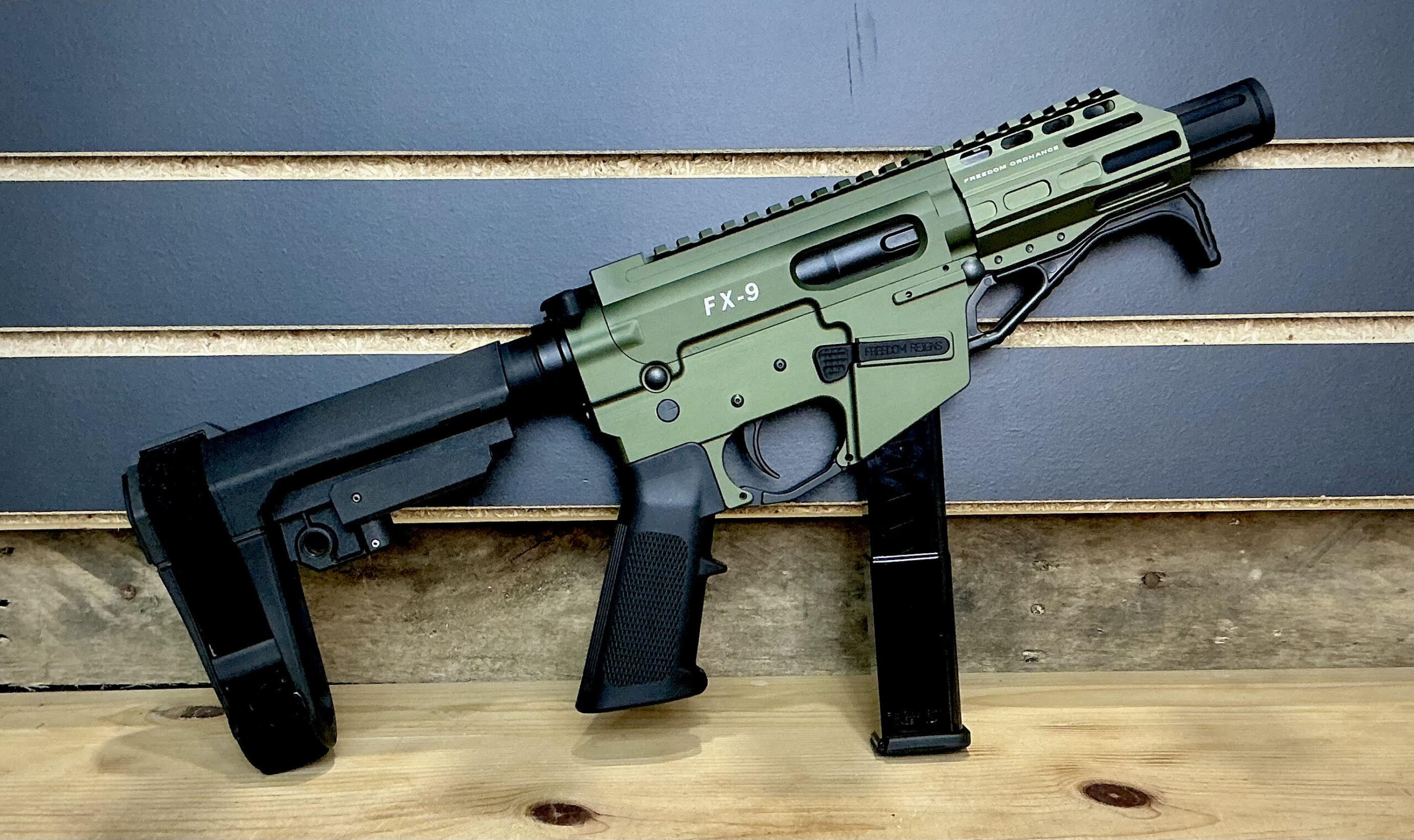 Freedom Ordnance, FX9 Sling, Semi-automatic Pistol, Full Size, 9MM, 4" Barrel, Aluminum Frame, Anodized Finish, Olive Drab Green, Polymer Grip, Manual Safety, Pistol Buffer Tube, M-LOK Free Float Handguard, 32 Rounds, 1 Magazine, Includes QD Bungie Sling